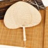 Peach-shaped raffia hand fan, straight shank