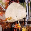 Peach-shaped raffia hand fan, straight shank