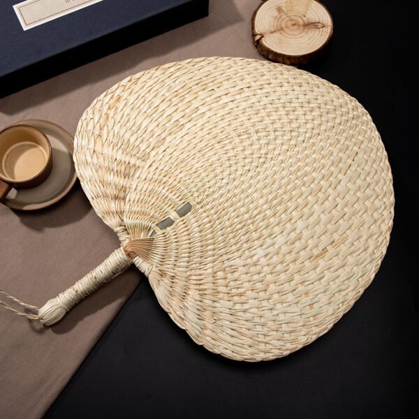 Peach-shaped raffia hand fan, straight shank