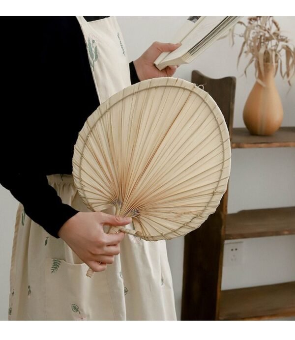 Handmade raffia palm fan