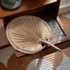 Handmade raffia palm fan