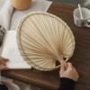 Handmade raffia palm fan