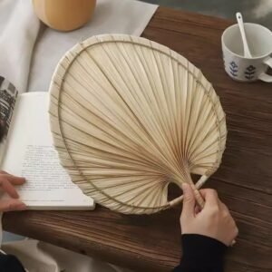 Handmade raffia palm fan