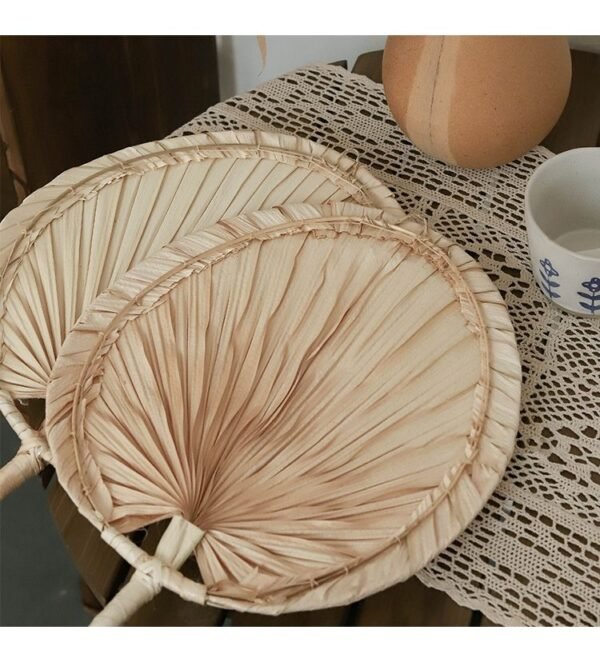 Handmade raffia palm fan