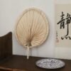 Handmade raffia palm fan