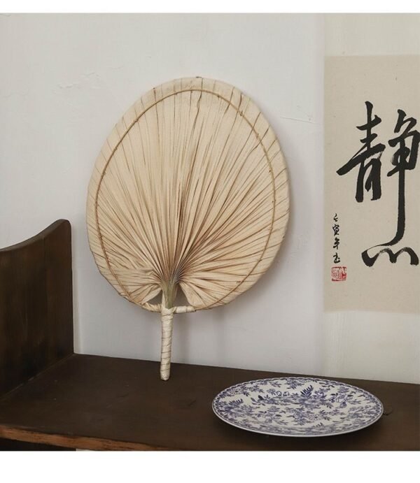 Handmade raffia palm fan