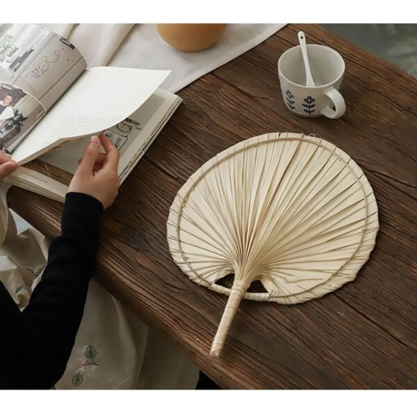 Handmade raffia palm fan